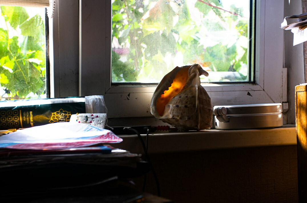 Desk with laptop and claim documents under warm light