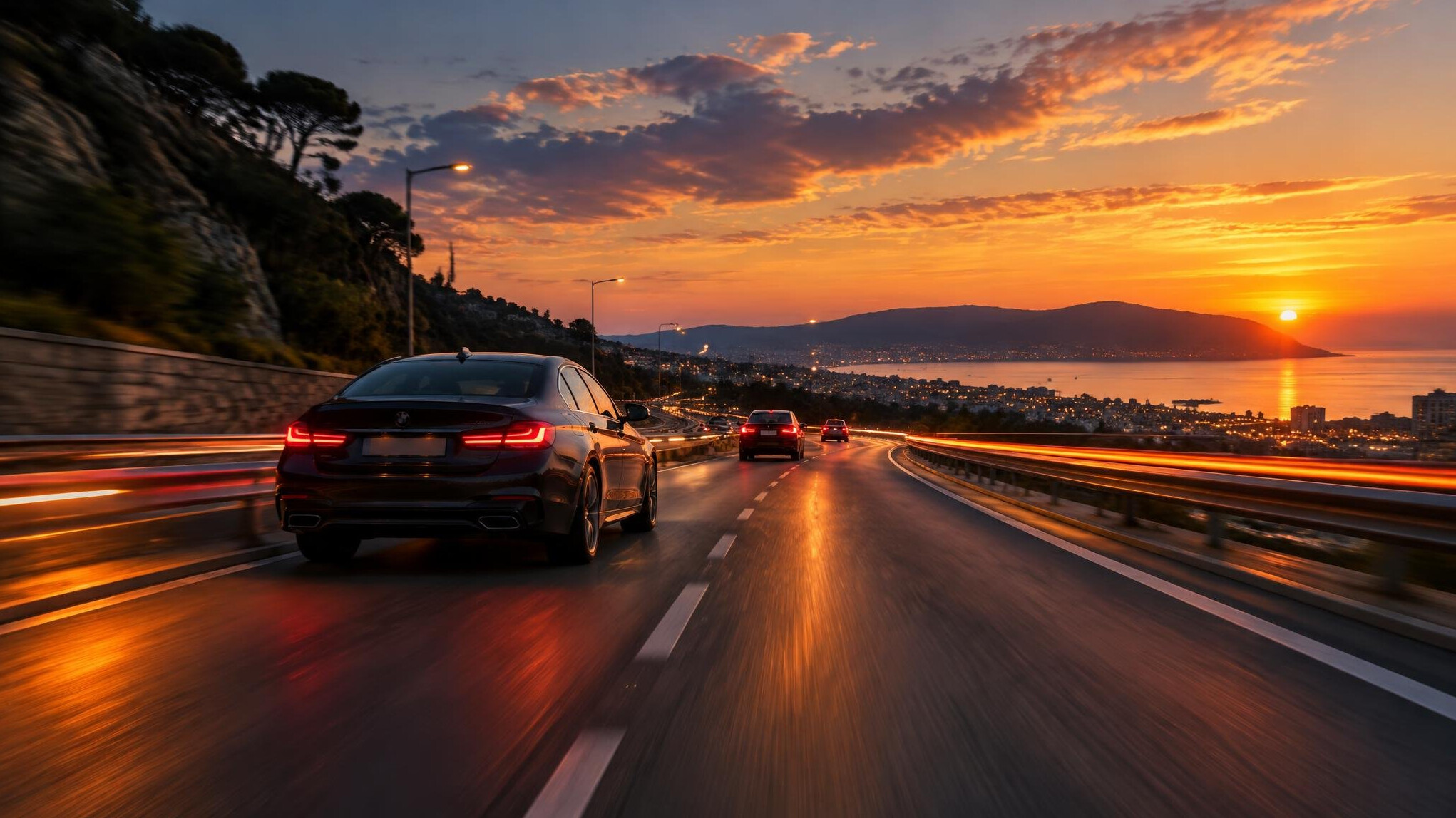 Cars on a road at dusk with light trails
